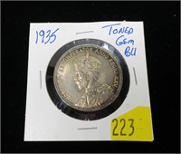 1935 Canadian silver dollar, toned gem BU