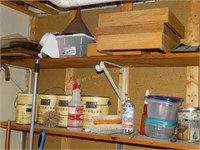 Contents of shelves in basement beside dryer