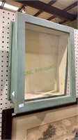 Hanging wood shadowbox with a hinged glass front
