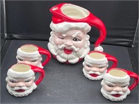 Signed ceramic Santa pitcher and mugs