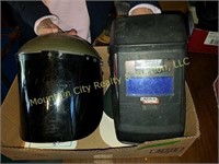 2 welding helmets, gloves