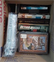 box of VHS and DVD movies with DVD player
