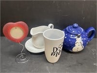 Snowman themed teapot with creamer and saucer,