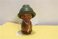 An Antique Figural Stopper