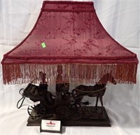 FIGURAL LAMP W/ HORSE CARRIAGE & RED FRILLED SHADE