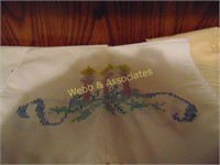 Hand cross stitched pillow cases and doilies
