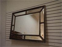 Beveled wall mirror with fancy gesso frame,