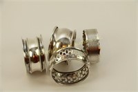 FOUR ASSORTED STERLING GEORGE V NAPKIN RINGS