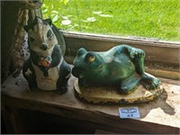 Frog and skunk statues