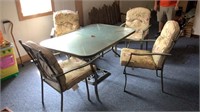 Patio furniture  Glasss topped table & four chair