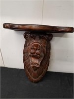 Beautiful carved lion head wall hanging with shelf