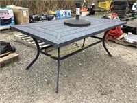 D1. metal patio table with umbrella stand