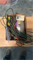 Assorted kitchen drawer tools and extension cords