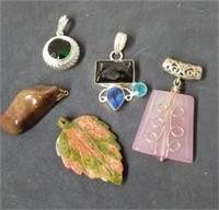 Group of necklace pendants some appear to be