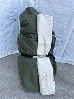 Green sleeping bag with ground sheet