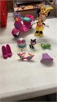 Minnie Mouse with scooter, kitty, extra clothes,