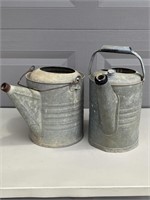 Pair of galvanized watering can