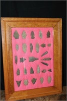 Assortment of 28 arrow heads framed. Partial