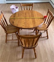 Solid wood drop leaf table w/4chairs. 40in overall