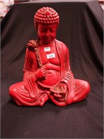 11" red Asian Buddha figurine with a jewel