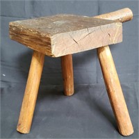 Antique rustic three-legged milking stool