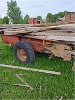 Offsite Spreader full of slab wood