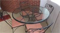 Wrought Iron,Glass Top PatioTable w/4 Padded Seats