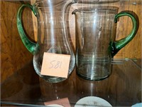 PAIR OF GREEN HANDLE GLASS PITCHERS