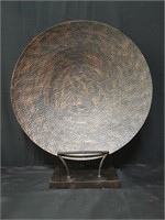 Large copper decorative hammered plate on stand