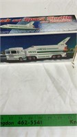 Hess toy truck and space shuttle with satellite.