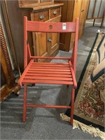 Stained Red Folding Chair