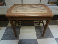 OLD CANE TOPPED WOODEN TABLE W/ MEDALLION