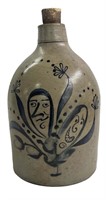 COBALT DECORATED JUG W/ TWO FACE DECORATION