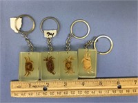 Lot of 4 key chains with crabs set in Lucite