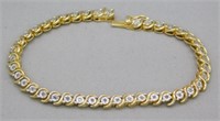 7" GOLD OVER SILVER BRACELET.