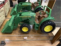 Plastic John Deere tractor with scoop