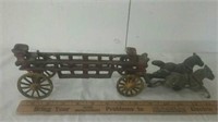 Vintage cast iron kart with two horses