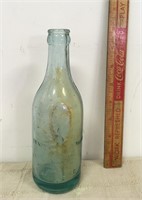 EARLY GLASS ADVERTISING BOTTLE WITH SQUIRREL