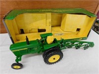 J. Deere 3020 tractor w/ four bottom plow