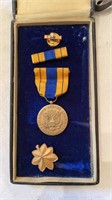 WWII selective service medal in the original box