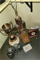 Binoculars, trophies, cards, bank and clock