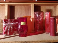 Assorted red glassware, vases