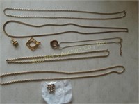 5 Gold toned necklaces & pendants