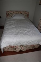 Full size bed with linens and 2 bedroom chairs