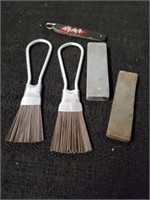 Two knife sharpening stones with finger brooms