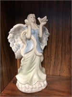 Porcelain angel in clouds with dove figurine