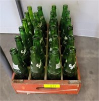 GROUP OF SPRITE BOTTLES IN WOODEN CRATE