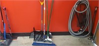 Brooms, dustpan, and snow shovel.