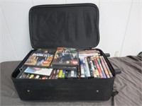 Small Rolling Suitcase Packed With Various DVD's