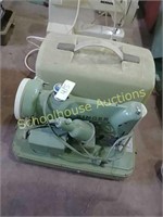 Green singer sewing machine with case. Cat. no.